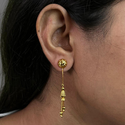 Nira Kalyani Gold Plated sui dhaga earrings worn on an ear with a close-up view 