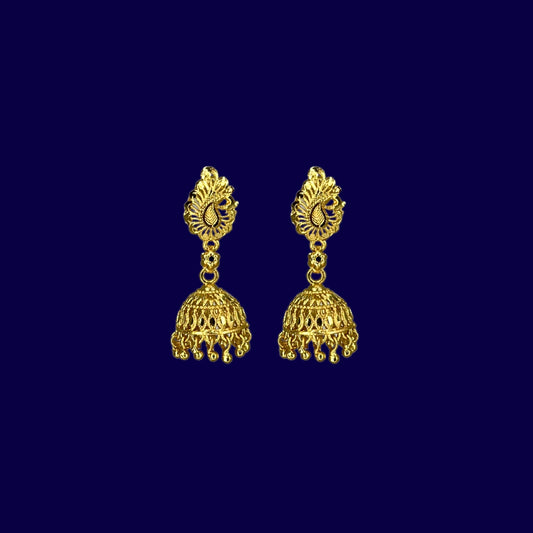 Pair of Nira Kalyani gold plated jhumka earrings on a dark blue background